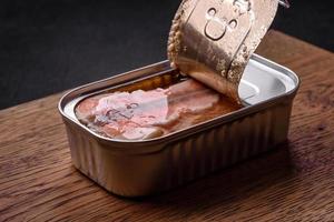 Tin or aluminum rectangular can of canned salmon with a key photo