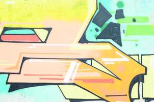 Background image with a colored graffiti pattern, which is applied to the concrete wall with aerosol paints. A lot of contours and fragments filled with paint, forming an interesting composition photo