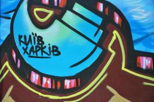 The old wall, painted in color graffiti drawing blue aerosol paints. Background image on the theme of drawing graffiti and street art photo