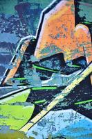 The old wall, painted in color graffiti drawing with aerosol paints. Background image on the theme of drawing graffiti and street art photo