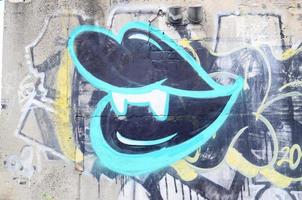 Background image with a graffiti pattern, which is applied to a concrete wall with aerosol paints photo