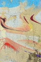 Abstract graffiti paintings on the concrete wall. Background texture photo