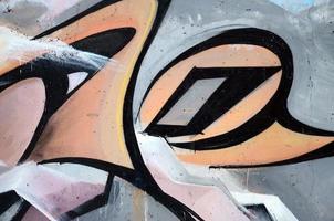 The old wall, painted in color graffiti drawing red aerosol paints. Background image on the theme of drawing graffiti and street art photo