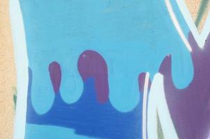 Background image with a graffiti pattern, which is applied to a concrete wall with aerosol paints photo
