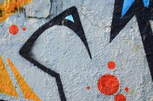 The old wall, painted in color graffiti drawing blue aerosol paints. Background image on the theme of drawing graffiti and street art photo