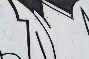 Background image of a concrete wall with a piece of abstract graffiti pattern. Street art, vandalism and youth hobbies photo