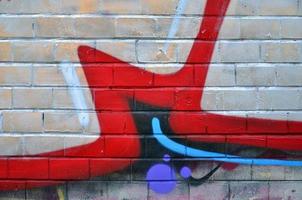 Art under ground. Beautiful street art graffiti style. The wall is decorated with abstract drawings house paint. Modern iconic urban culture of street youth. Abstract stylish picture on wall photo