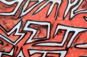 Background image of a concrete wall with a piece of abstract graffiti pattern. Street art, vandalism and youth hobbies photo