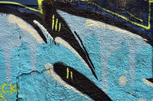Art under ground. Beautiful street art graffiti style. The wall is decorated with abstract drawings house paint. Modern iconic urban culture of street youth. Abstract stylish picture on wall photo
