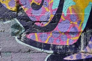 Art under ground. Beautiful street art graffiti style. The wall is decorated with abstract drawings house paint. Modern iconic urban culture of street youth. Abstract stylish picture on wall photo