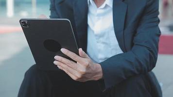 Businessman using tablet analyzing sales data and economic growth graph chart. Business strategy. Abstract icon. Digital marketing. video