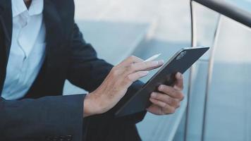 Businessman using tablet analyzing sales data and economic growth graph chart. Business strategy. Abstract icon. Digital marketing. video