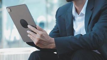 Businessman using tablet analyzing sales data and economic growth graph chart. Business strategy. Abstract icon. Digital marketing. video