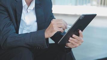 Businessman using tablet analyzing sales data and economic growth graph chart. Business strategy. Abstract icon. Digital marketing. video