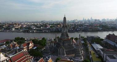 An aerial view of the Pagoda stands prominently at Wat Arun Temple with Chao Phraya River, The most famous tourist attraction in Bangkok, Thailand video