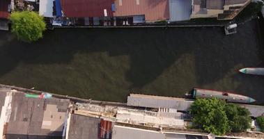 An aerial view of Long-tail boats with water traffic in Saen Sab Canal, The most famous tourist attraction in Bangkok, Thailand video