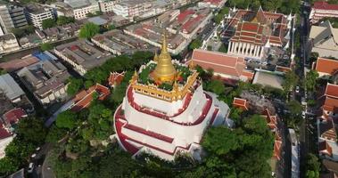 An aerial view of the Golden Mount stands prominently at Saket Temple, The most famous tourist attraction in Bangkok, Thailand video