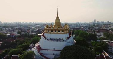 An aerial view of the Golden Mount stands prominently at Saket Temple, The most famous tourist attraction in Bangkok, Thailand video