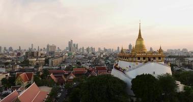 An aerial view of the Golden Mount stands prominently at Saket Temple, The most famous tourist attraction in Bangkok, Thailand video