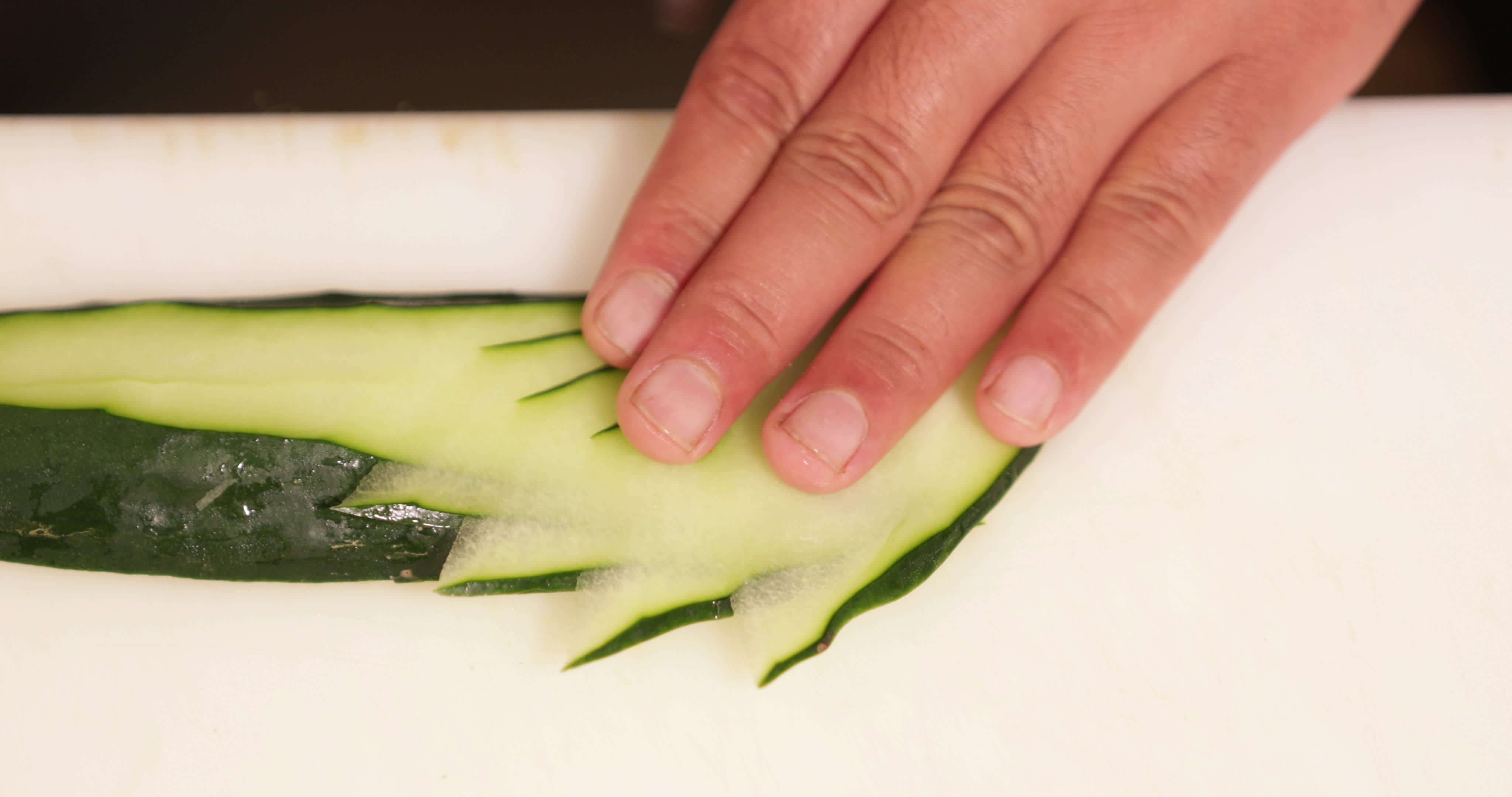 Slicing Fresh Cucumber With Style Sushi Plate Decoration close up