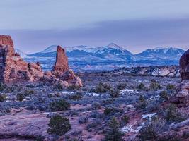 Panoramic picture of impressive sandstone formations in Arches National Park at night in winter photo