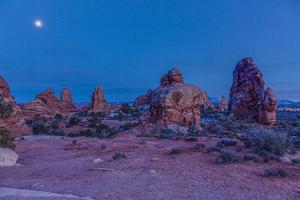 Panoramic picture of impressive sandstone formations in Arches National Park at night in winter photo