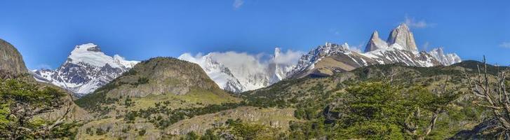 Panoramic picture of the famous summits Cerro Torre and Fitz Roy in Patagonia photo