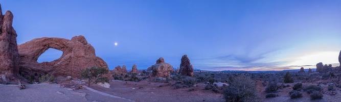 Panoramic picture of impressive sandstone formations in Arches National Park at night in winter photo