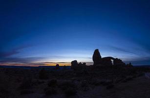 Panoramic picture of impressive sandstone formations in Arches National Park at night in winter photo