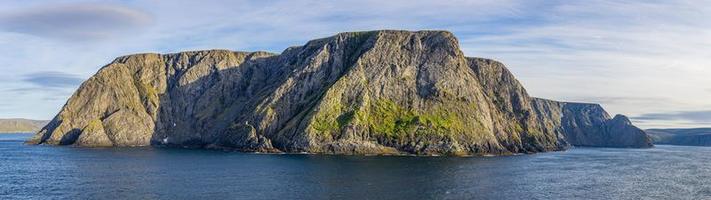 View to cliffs of north cape from sea view in summer photo