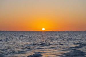 Sunset over sea with deserted beach in Florida photo