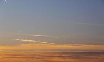Dramatic colorful sky with afterglow and illuminated clouds photo
