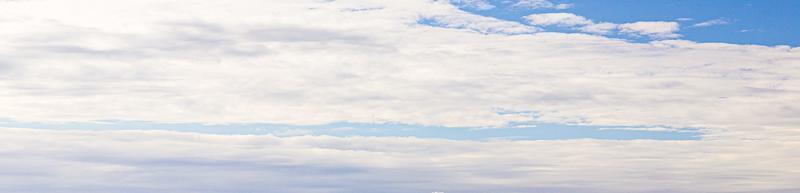 Image of a partly cloudy and partly clear sky during the day photo