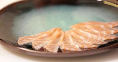 Plating Fresh Salmon Meat Sliced Thinly - Sashimi Preparation - close up tracking shot video