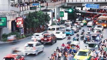 Bangkok, Thailand January 2, 2023 Time lapse of city street intersection in evening, there is a traffic jam at Siam BTS Station. Henri Dunant Road at Siam Paragon video