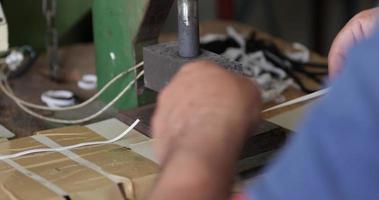 A Sew Factory Worker Cutting Elastic Strips Of Garter With A Machine Cutter - Covid-19 Pandemic - Medium Shot video