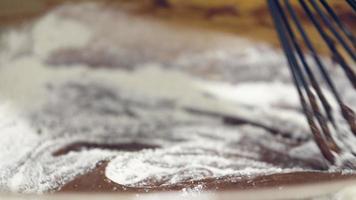 Stirring Of Flour And Melted Chocolate Mixture With Whisk In Slow Motion - Closeup Shot