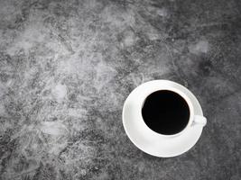 Black coffee in cup top view copy space dark background photo