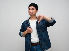 Man jeans shirt gerture show thumb down isolated photo