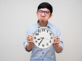 Angry manager man show analog clock in his hand isolated photo