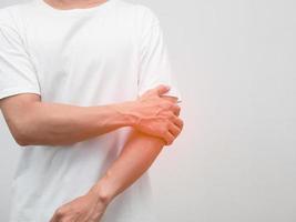 Male employee elbow pain from hard working office syndrome photo