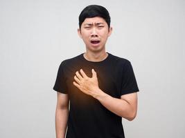 Asian man touch his chest feels pain his heart,Man heart disease photo