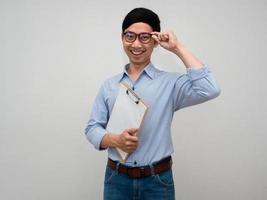 Positive businessman wear glasses hold document board cheerful smile posing confident looking isolated photo