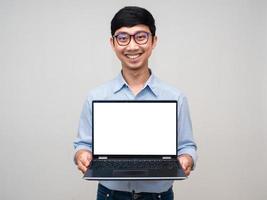 Positive asian businessman happy smile show laptop white screen isolated photo