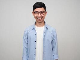 Positive asian businessman wear glasses blue shirt confident smile portrait photo