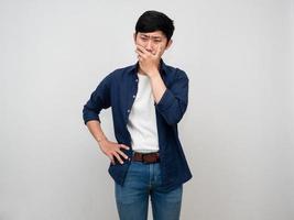 Sadness asian man standing cry and close his mouth isolated photo