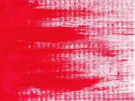 Abstract acrylic red paint texture on horizontal canvas. From left to right brushstrokes of red paint. Artistic background with place for text. photo