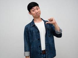 Positive asian man jeans shirt point finger at himself choose me concept isolated photo