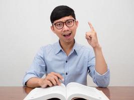 Positive asian businessman glasses cheerful show finger up get idea photo