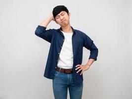Asian man stand hold his head feels headache and tried isolated photo